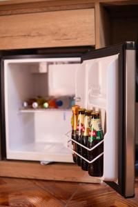 an open refrigerator filled with lots of beer at Casa Andora in Machu Picchu