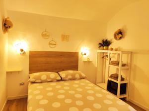 a bedroom with a bed with yellow walls at Calin Apartment in Turin