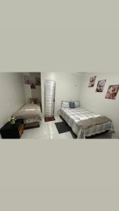 2 camas en una habitación con 2 camas en Aconchego Hospedagem, en Barreirinhas