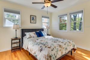 a bedroom with a bed and a ceiling fan at Spacious Fanwood Home with Decks, Walk to Park! in Plainfield