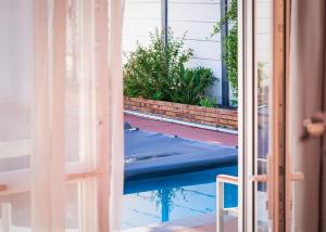 a view of a swimming pool through a door at Mindful Escape Cottage in Heathfield