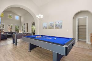 a pool table in the middle of a living room at The Rivercrest Branch House - Close to Costco, Boat Ramp, Fishing, and Shopping in Redding