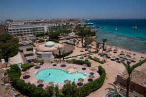 an aerial view of a resort with a swimming pool at Dexon Roma All Inclusive Hotel in Hurghada