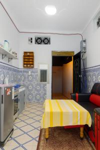 a living room with a couch and a table at DAR Souaad Bab Doukkala in Marrakech