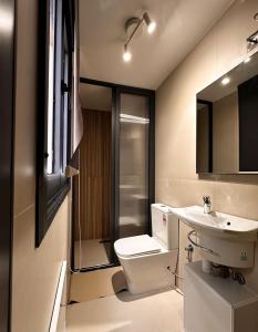 a bathroom with a toilet and a sink at Relax Family ApartHotel in Ouarzazate +75 photos