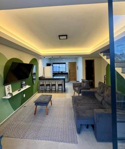 TV a/nebo společenská místnost v ubytování House Serrana