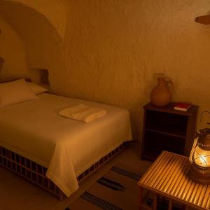 Ένα ή περισσότερα κρεβάτια σε δωμάτιο στο Soléi Salt Caves