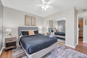 a bedroom with a bed and a ceiling fan at Boulder Basecamp - Cozy 2BR Near Trails & Town  +14 photos