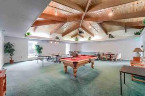 a large room with a pool table in it at Boulder Basecamp - Cozy 2BR Near Trails & Town 