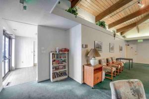 a living room with a couch and a table at Boulder Basecamp - Cozy 2BR Near Trails & Town 