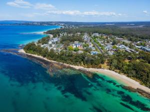 an aerial view of an island in the ocean at Sunny Townhouse in Huskisson +6 photos