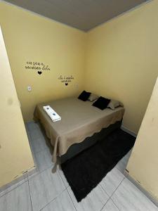 a bedroom with a bed with a sign on the wall at Pousada Maré do Cerrado in Mateiros +21 photos