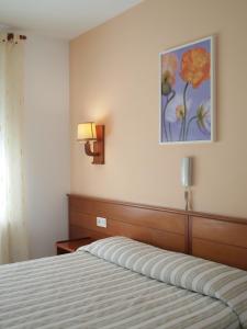 Postel nebo postele na pokoji v ubytování Hotel El Castell