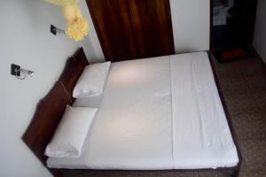 Postelja oz. postelje v sobi nastanitve My Place Hikkaduwa
