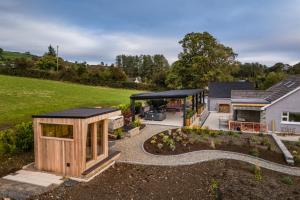 an extension of a house with a garden at Rosies Cottage in Rostrevor