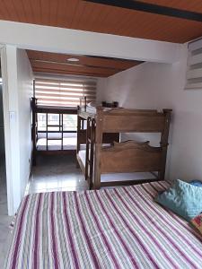 Ένα ή περισσότερα κρεβάτια σε δωμάτιο στο Finca en Alcalá valle del cauca