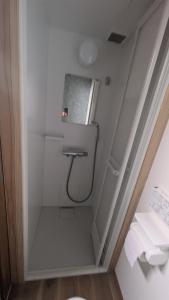 a small bathroom with a sink and a toilet at KuraYado au coeur de Kurayoshi in Kurayoshi