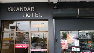 a hotel sign on the side of a building at Hotel Iskandar in Kota Kinabalu