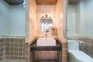 a bathroom with a sink and a toilet at Flower without boundry in Lijiang +101 photos