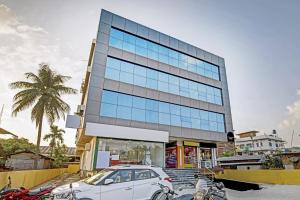 a car parked in front of a building at Townhouse OAK Hi-City in Kamakhya