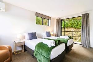 Giường trong phòng chung tại Grand Alpine Villa - 4 bedrooms