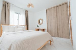 Ένα ή περισσότερα κρεβάτια σε δωμάτιο στο Villa Marine