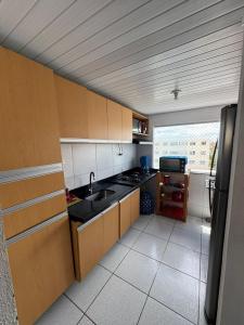 Køkken eller tekøkken på Apartamento Mobiliado para seu conforto + 13 billeder