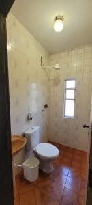 a bathroom with a toilet and a sink at Pousada Shemah in Penedo +60 photos