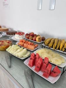 a buffet with many different types of food on display at Pousada Vó Dena in Penha