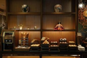 a display case in a store filled with lots of items at Silverland Sakyo Hotel in Ho Chi Minh City