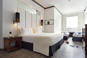 Кровать или кровати в номере Meliá Milano