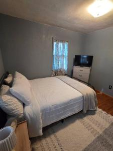 a bedroom with a large bed and a window at The Nelson House in Winner
