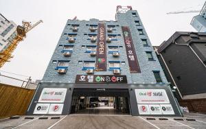 a building with a sign on the front of it at On & Off Hotel in Incheon