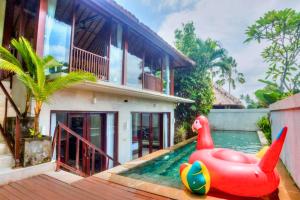 a house with a pool with a inflatable rubber duck in the water at Aitana 3 BR Private Pool Villa ZN286 in Blahbatu