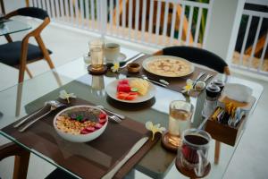 a table with plates of food on top of it at lumbung asmara in Singaraja