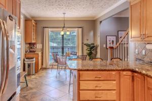 a kitchen with a counter top and a dining room at Labrador Lake with FirePit and Billiards in Hope Mills