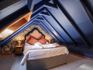 a bedroom with a bed with a blue ceiling at 83 Seatown in Buckie