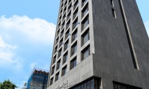 a tall grey building with a sign on it at Dobong Hotel Bay204 in Seoul