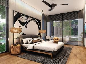 a bedroom with a bed and a ceiling fan at MontAzure Resort Phuket - MGallery Collection in Phuket Town +17 photos