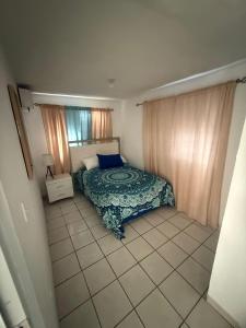 Ένα ή περισσότερα κρεβάτια σε δωμάτιο στο Luz del mar