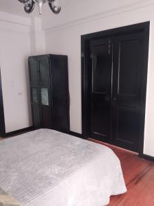 Postel nebo postele na pokoji v ubytování Centro histórico Candelaria Antigua