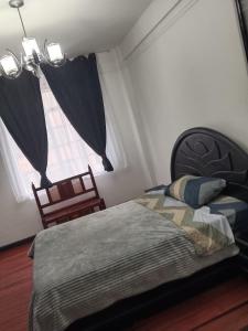 Postel nebo postele na pokoji v ubytování Centro histórico Candelaria Antigua