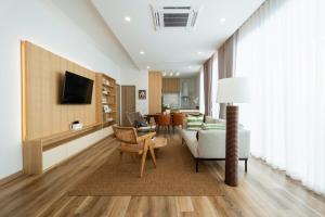 a living room with a couch and a table at New Algaea Pool Villa 3BR Jacuzzi - Krabi Ao Nang in Ban Khlong Haeng