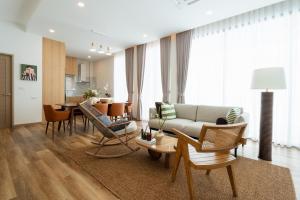 a living room with a couch and chairs and a table at New Algaea Pool Villa 3BR Jacuzzi - Krabi Ao Nang in Ban Khlong Haeng