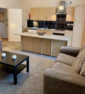 a living room with a couch and a kitchen at Flat In Tyne Wear Sunderland in Sunderland
