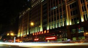 a building at night with a street in front of it at Southeast Peninsula Hotel Quanzhou in Quanzhou