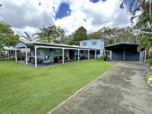 an image of a house with a yard at Happy Daze in Amity Point