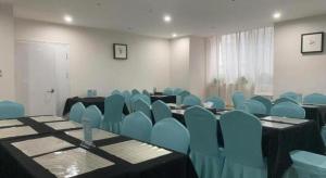 a conference room with blue chairs and tables at Xana Hotelle Xi'an 2nd Fengcheng Road Municipal Library Metro Station in Xi'an +24 photos