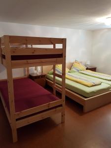 מיטה או מיטות בחדר ב-Gästehaus Futterer