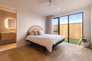 a bedroom with a bed and a large window at Wave Break in North Creek +19 photos